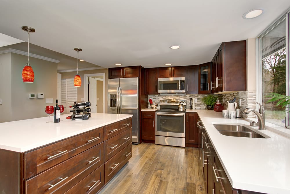 Large Kitchen With White Counter Tops And A Big Island ?strip=all&lossy=1&resize=1000%2C667&ssl=1