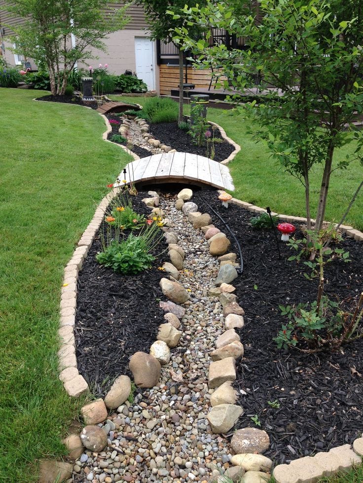 Dry Creek Bed Landscaping with A Rock Bridge