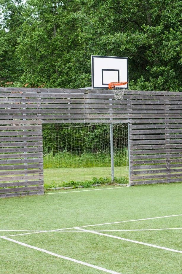 backyard basketball court and batting cage